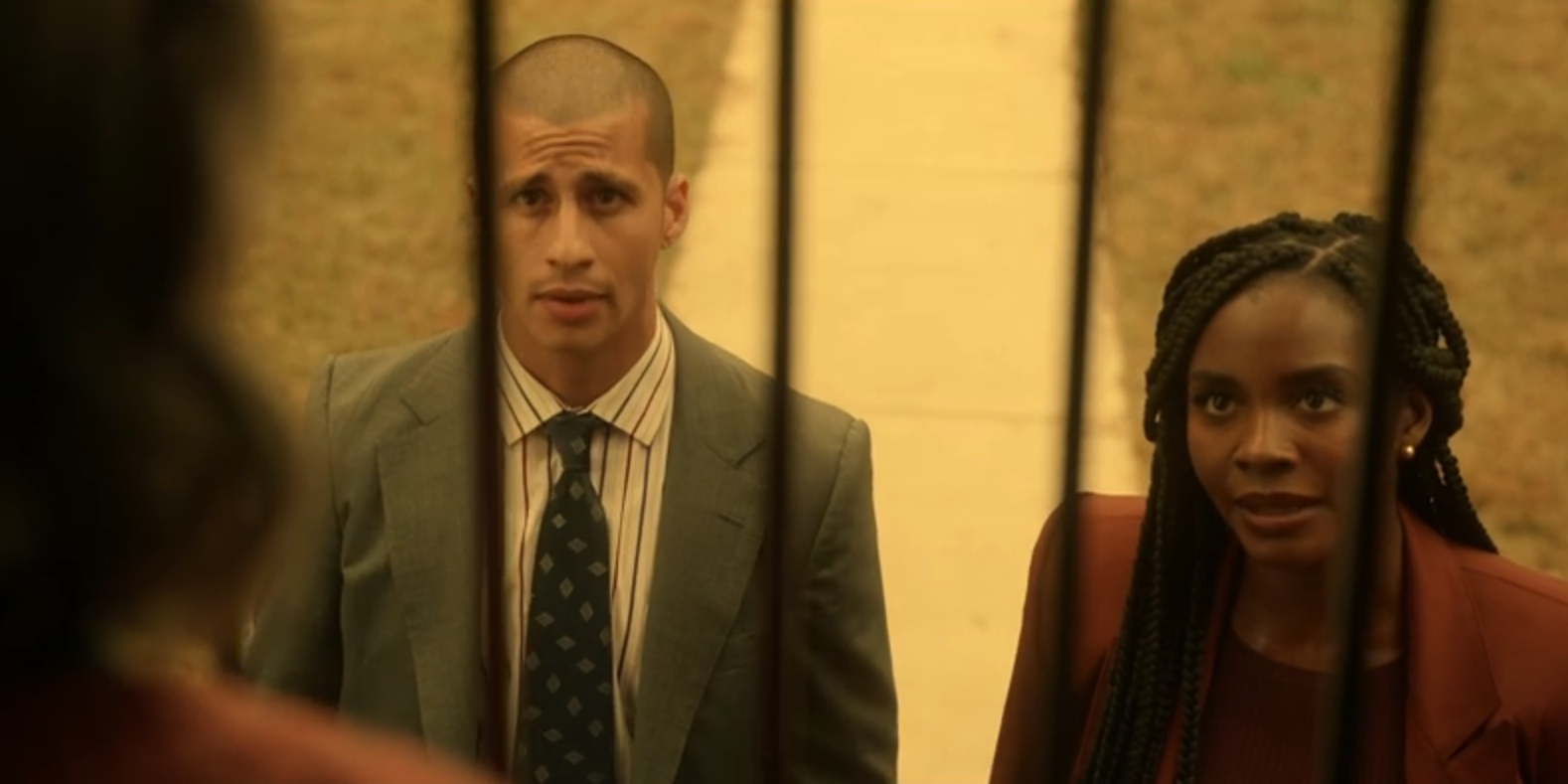 Carlito Olivero as Joaquin Diaz standing next to Dawn Reeve in Them: The Scare