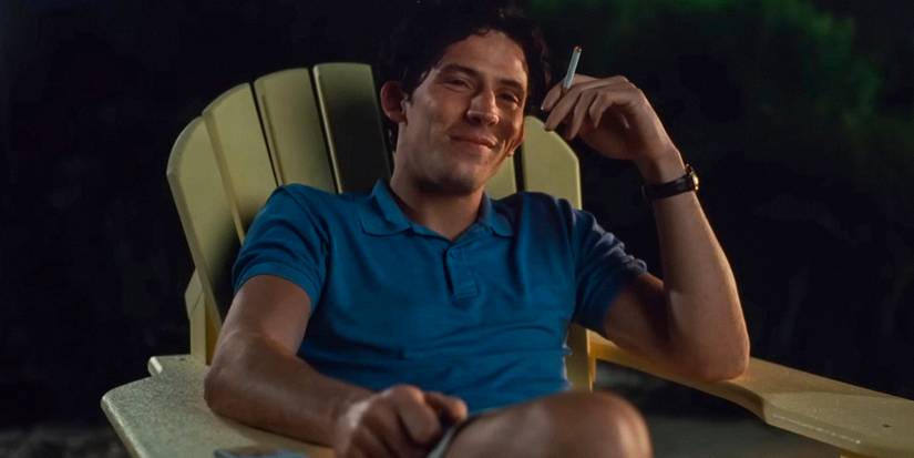 Josh O'Connor as Patrick Zweig smiling while smoking a cigarette in Challengers