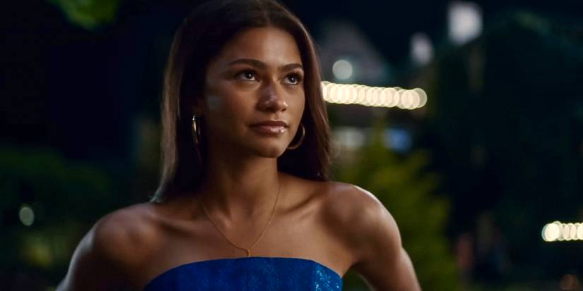 Tashi wearing a blue dress while outside in Challengers