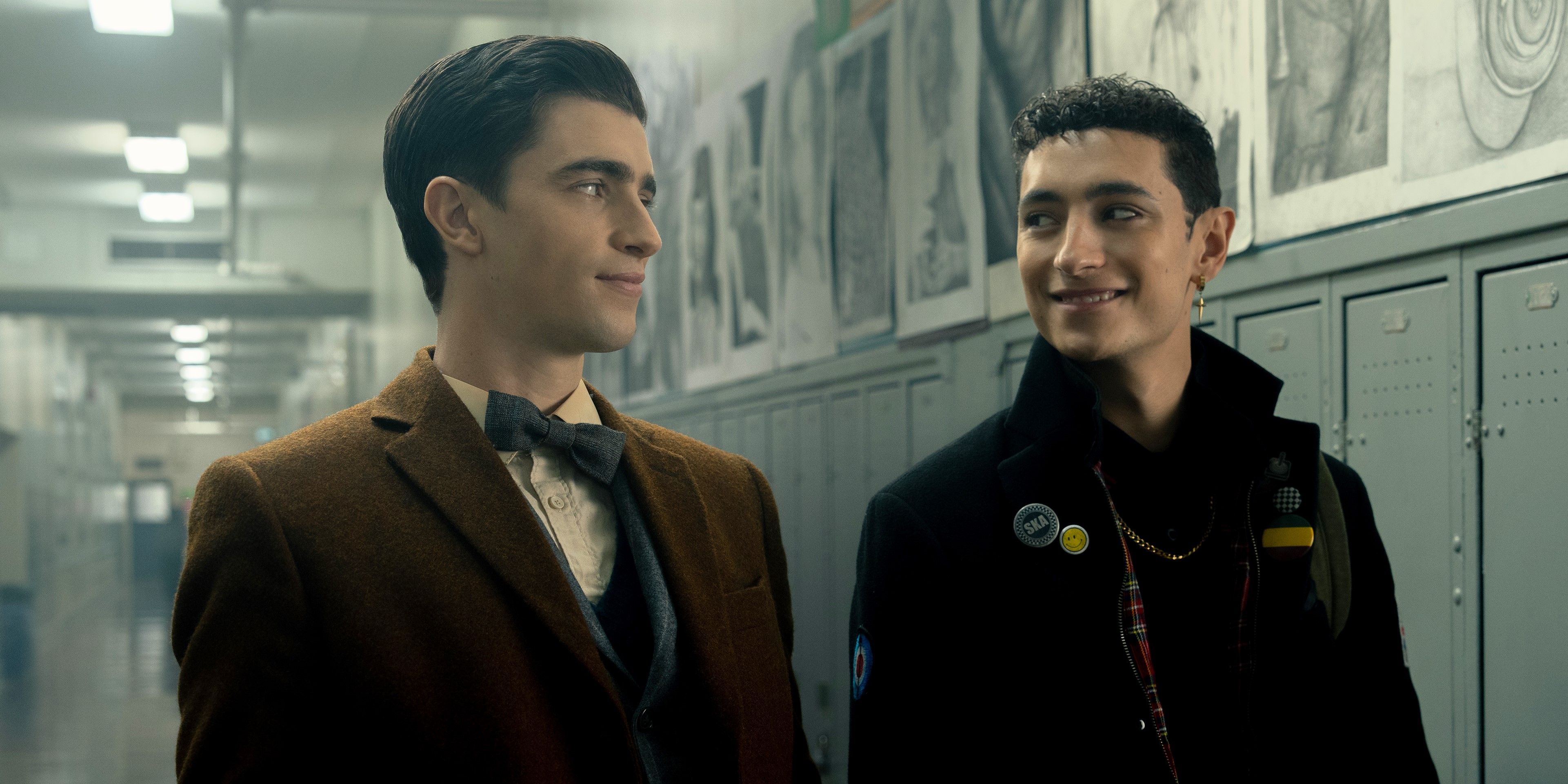 Charles and Edwin smile at each other in the hallway in Dead Boy Detectives