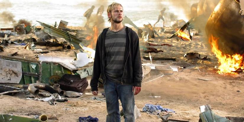 Charlie standing amongst the plane wreckage and looking confused in Lost