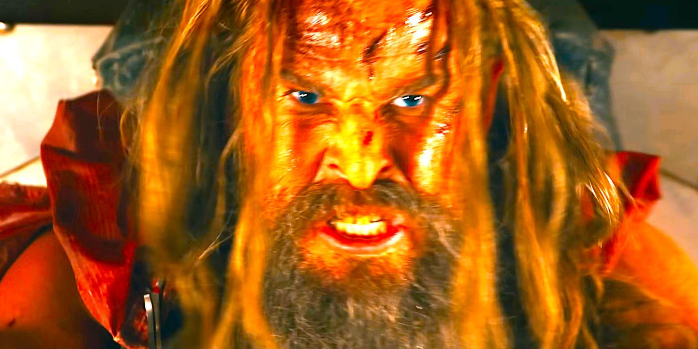 Chris Hemsworth as Dementus wears a crazed expression in a scene from Furiosa: A Mad Max Saga