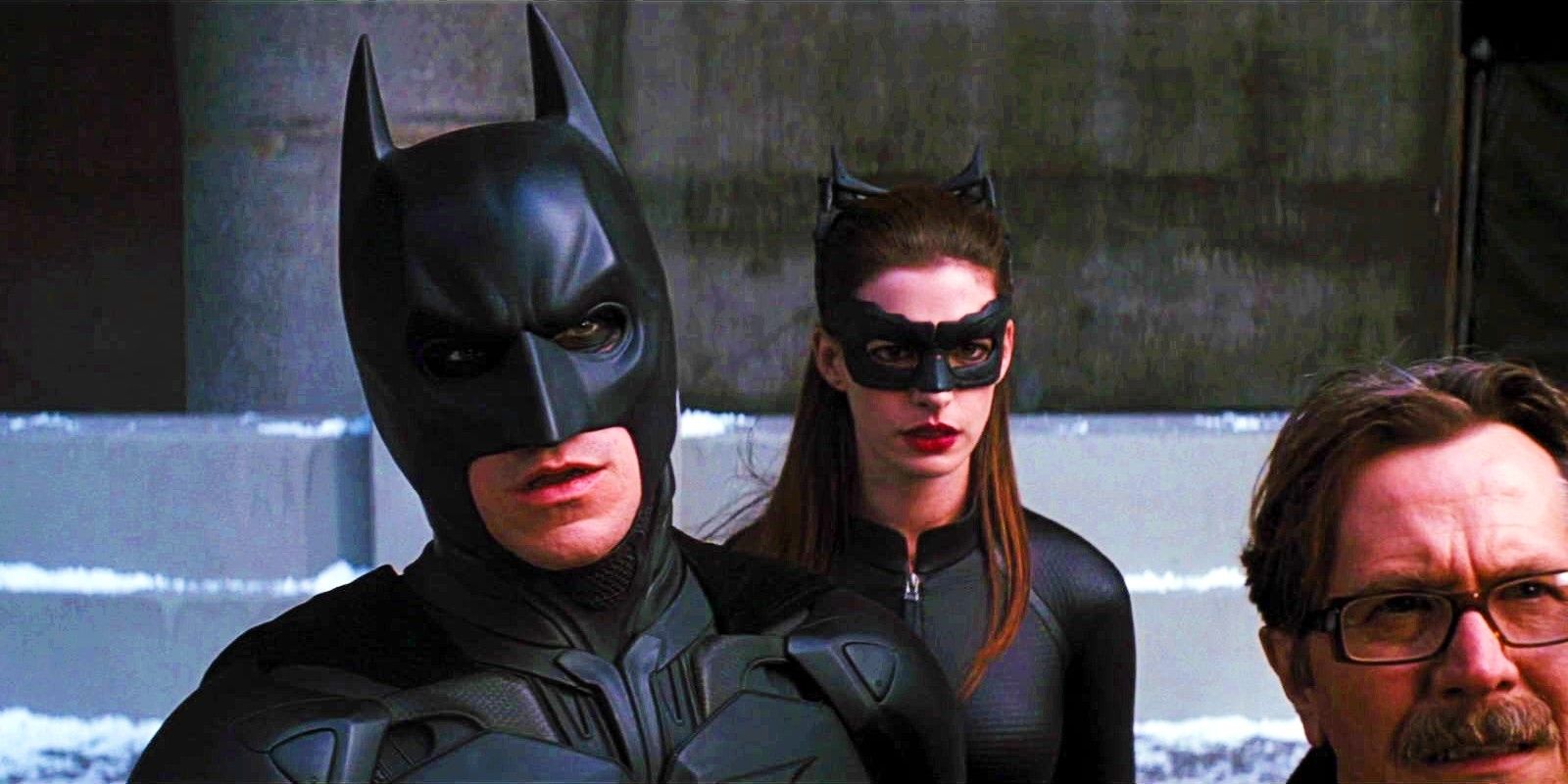 Christian Bale As Bruce Wayne In Full Batman Costume With Anne Hathaway In Catwoman Costume In The Dark Knight Rises