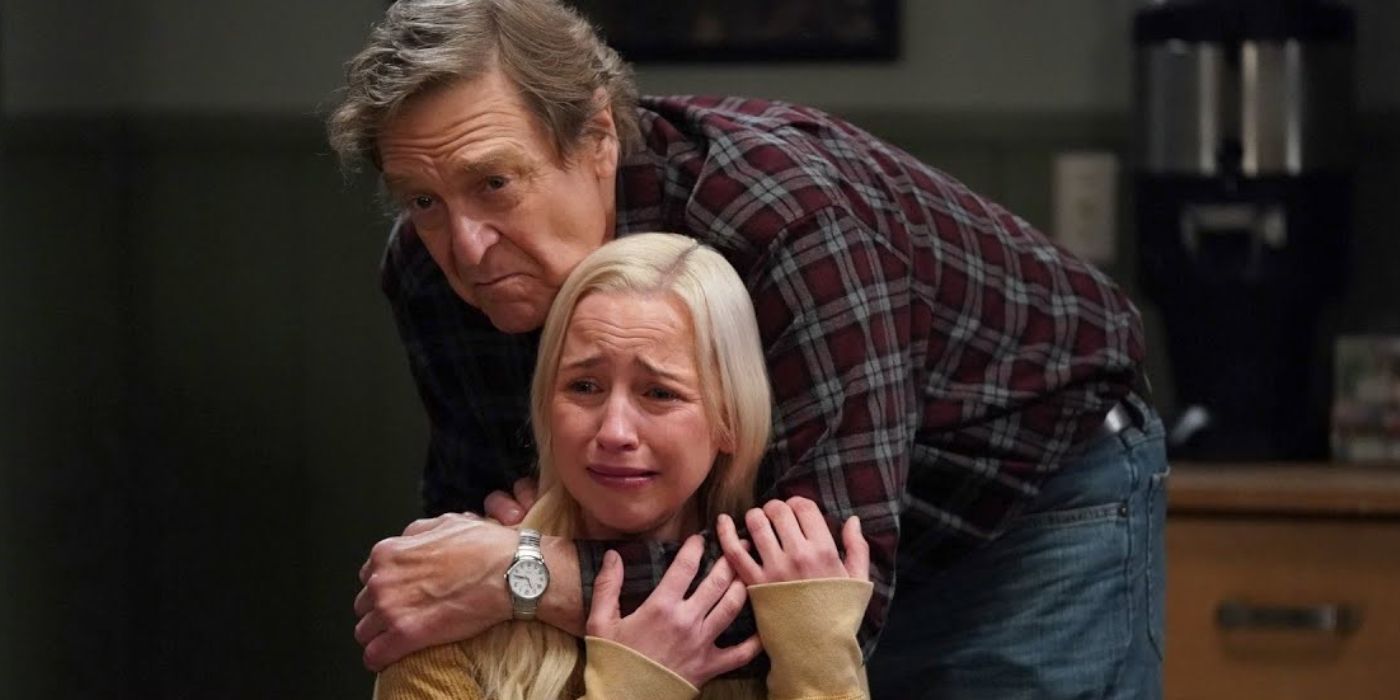 Dan Conner (John Goodman) huugging Becky (Lecy Goranson) as she cries over Mark Healy in The Conners.