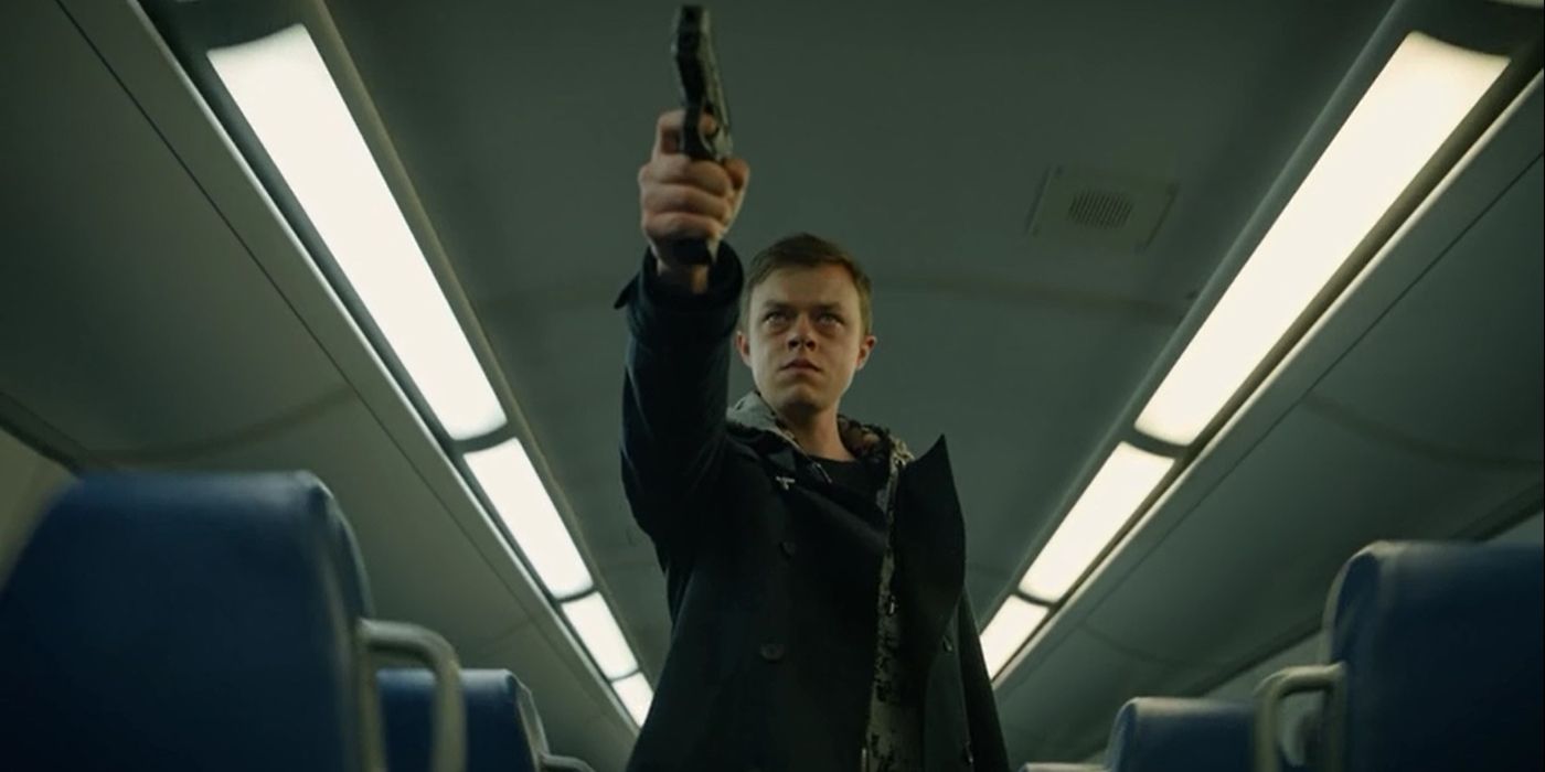 Dane DeHaan as Carl E. pointing a gun in The Stranger