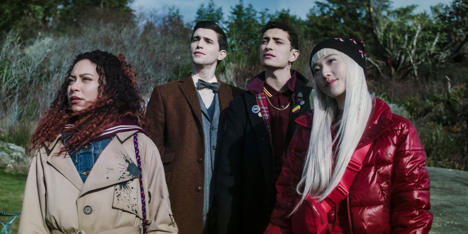 Crystal, Edwin, Charles, and Niko in the middle of the forest, looking at something with suspicion in Dead Boy Detectives season 1