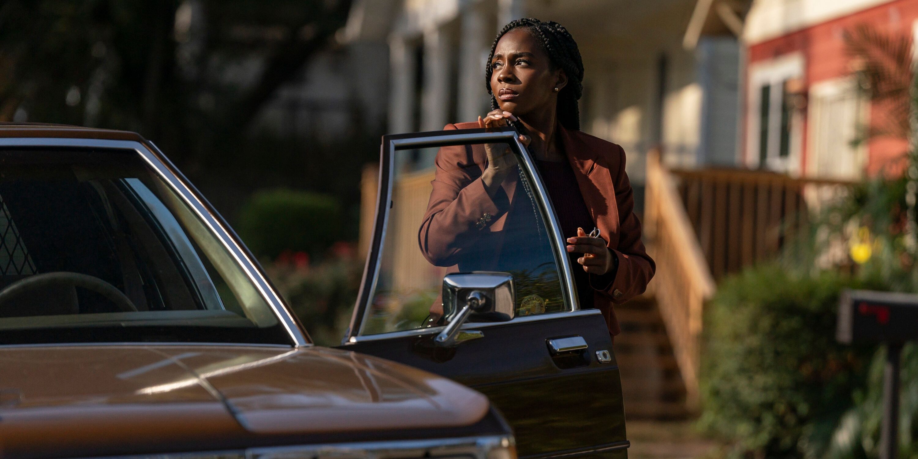 Deborah Ayorinde steps out of her detective car in Them The Scare still