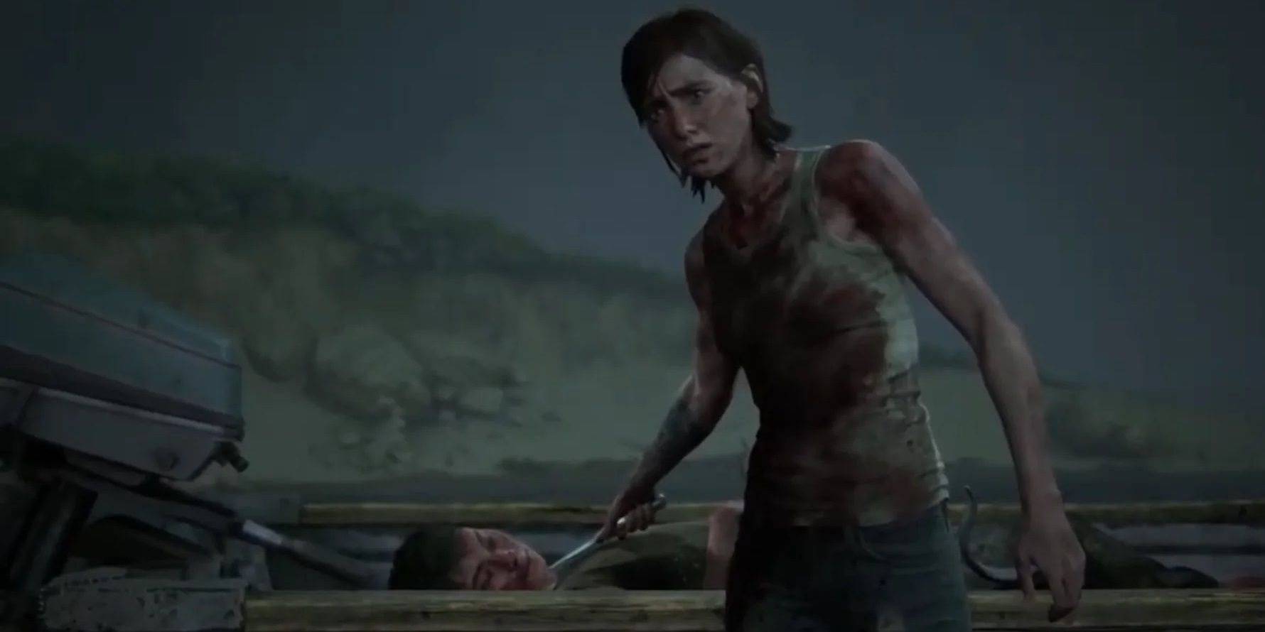 Ellie aponta uma faca para a garganta de Lev em The Last of Us Part II