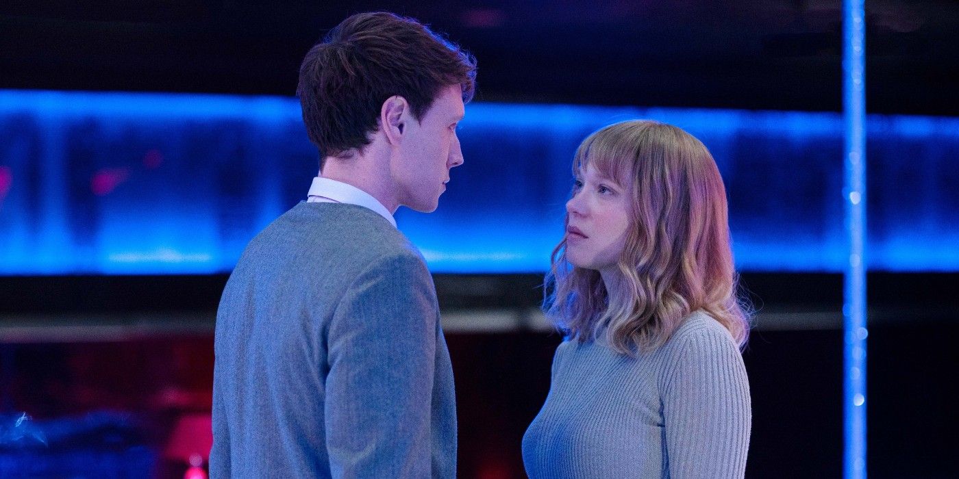 george mackay and lea seydoux standing close to one another in a club in thebeast
