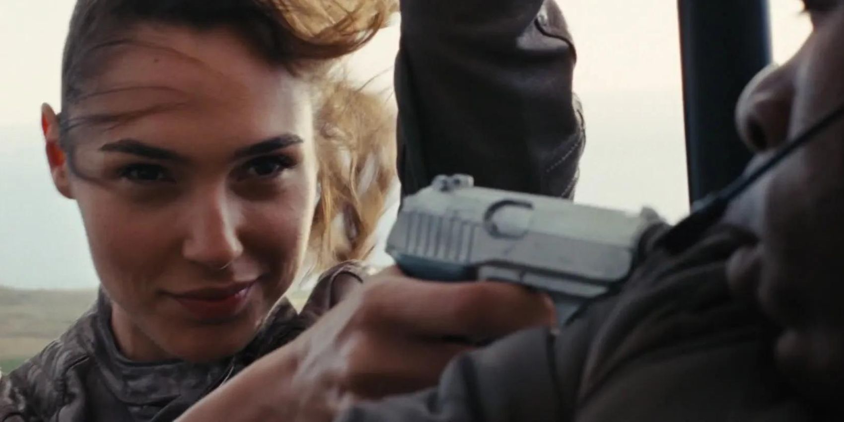 Gisele smiling at Han and holding up a gun in Fast & Furious 6
