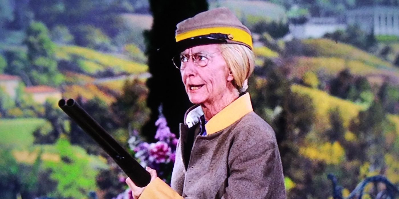 Granny (Irene Ryan) dressed in a Civil War outfit and holding a shotgun in The Beverly Hillbillies.