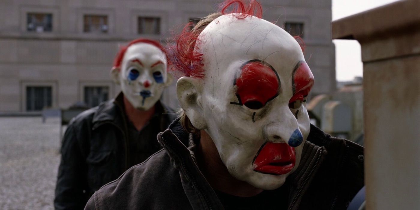Two bank robbers in clown masks in The Dark Knight