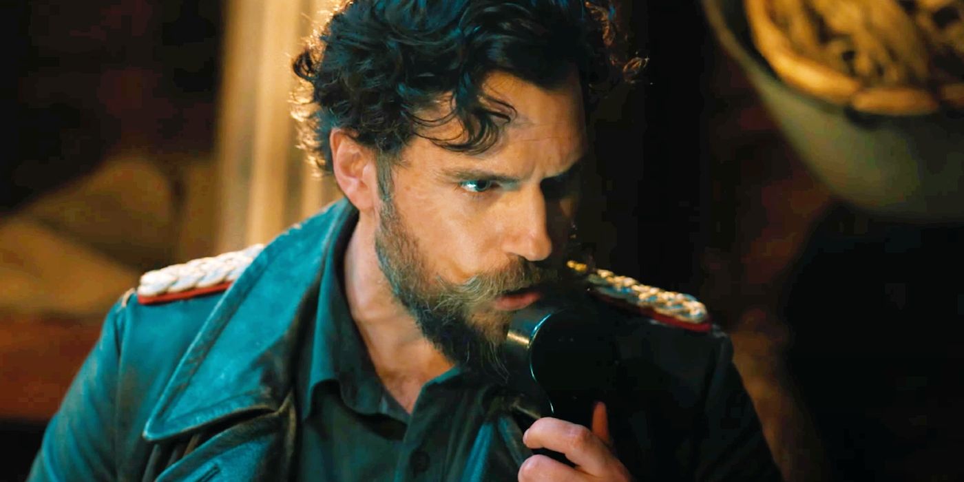 Henry Cavill as Gus speaking into a radio in The Ministry of Ungentlemanly Warfare