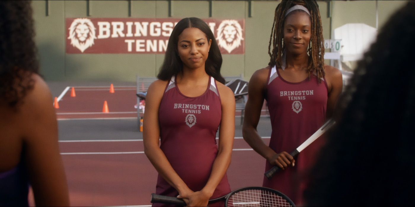 Camille Hyde stands in front of the tennis team with a smug look on her face in All American Homecoming