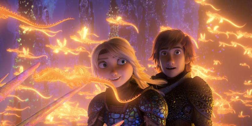 Astrid and Hiccup surrounded by glowing images of dragons in How To Train Your Dragon The Hidden World (2019) 