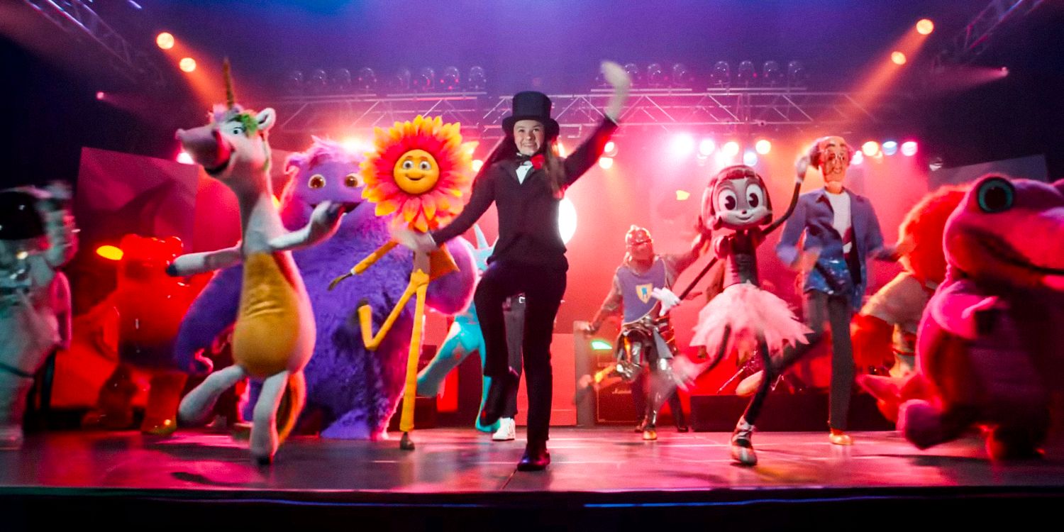 Bea on stage performing a choreography with some imaginary friends in IF movie trailer