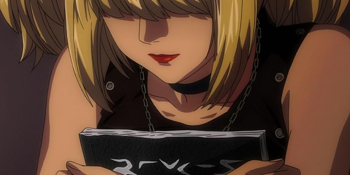 Misa holding the Death Note notebook
