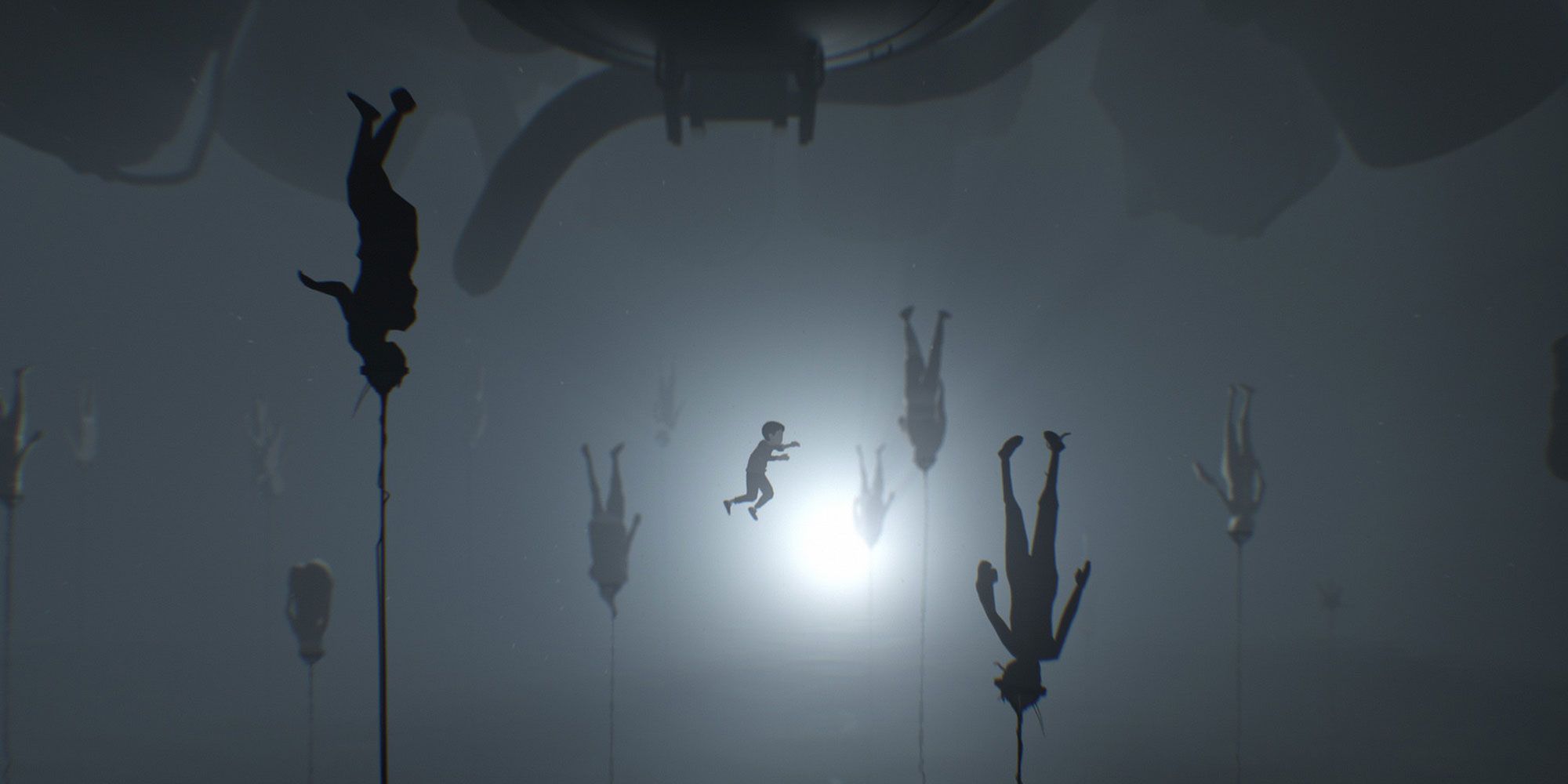 Characters hanging upside down with a light in the background. 