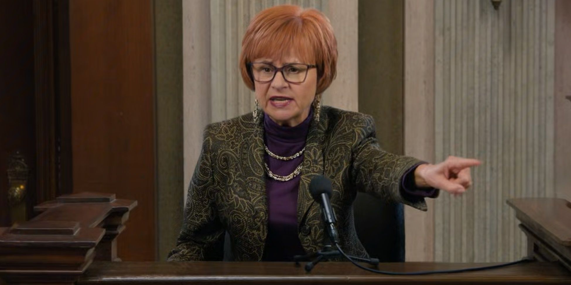 Irma Kostroski (Tracey Ullman) takes the stand in court and points in Curb Your Enthusiasm