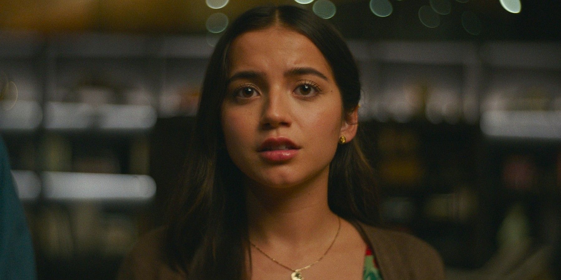 Isabela Merced looking scared yet whistful in Turtles All the Way Down