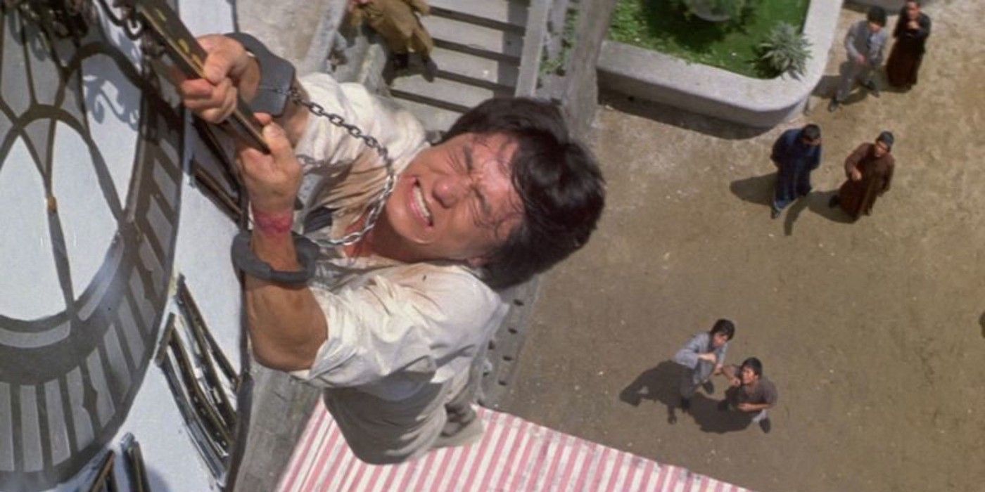 Jackie Chan hanging from clock in Project A