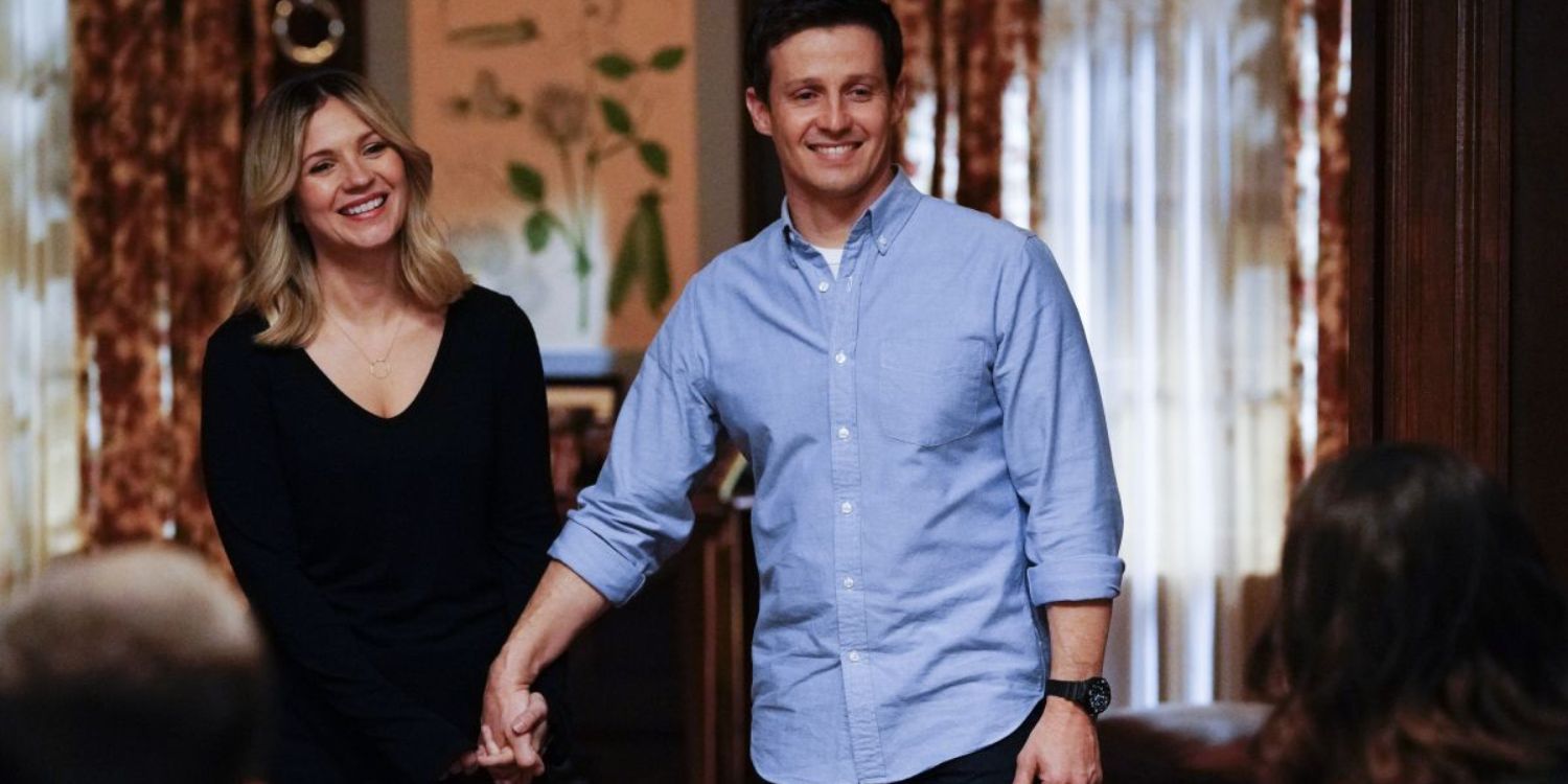 Jamie (Will Estes) and Eddie (Vanessa Ray) holding hands at the Reagan family dinner in Blue Bloods