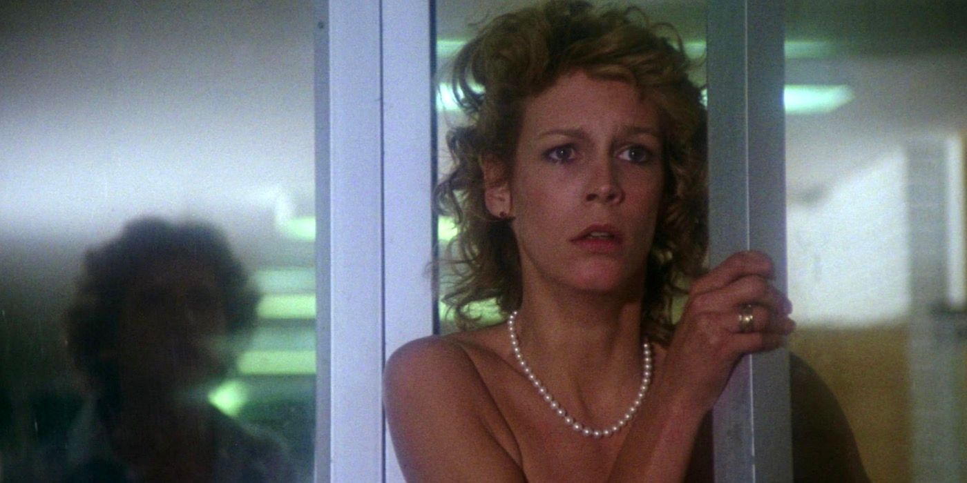 Jamie Lee Curtis is looking into the distance with a worried expression. 
