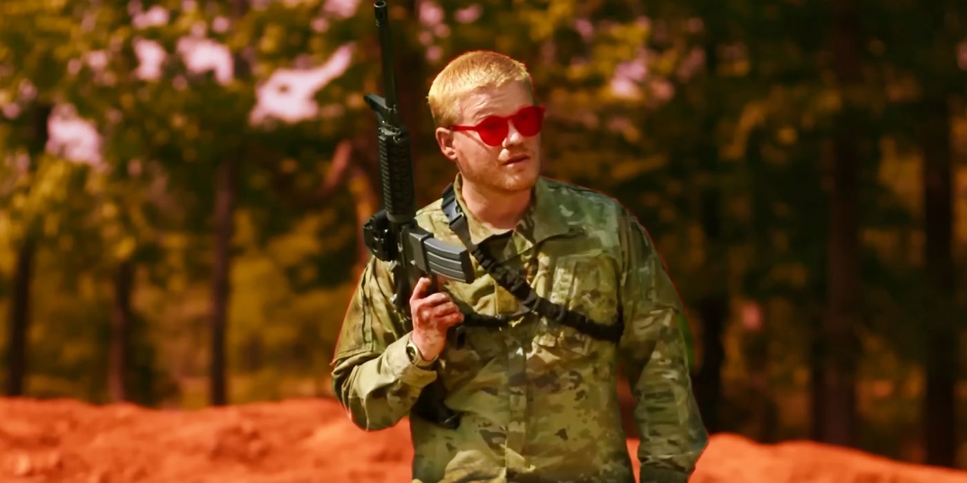 Jesse Plemons in camouflage and holding a gun in Civil War