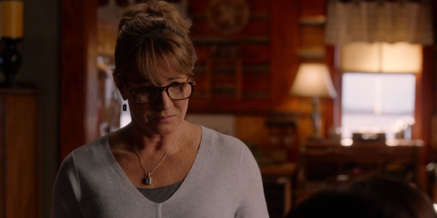 Jessica Steen as Lisa Stillman wearing glasses and looking downward in Heartland.