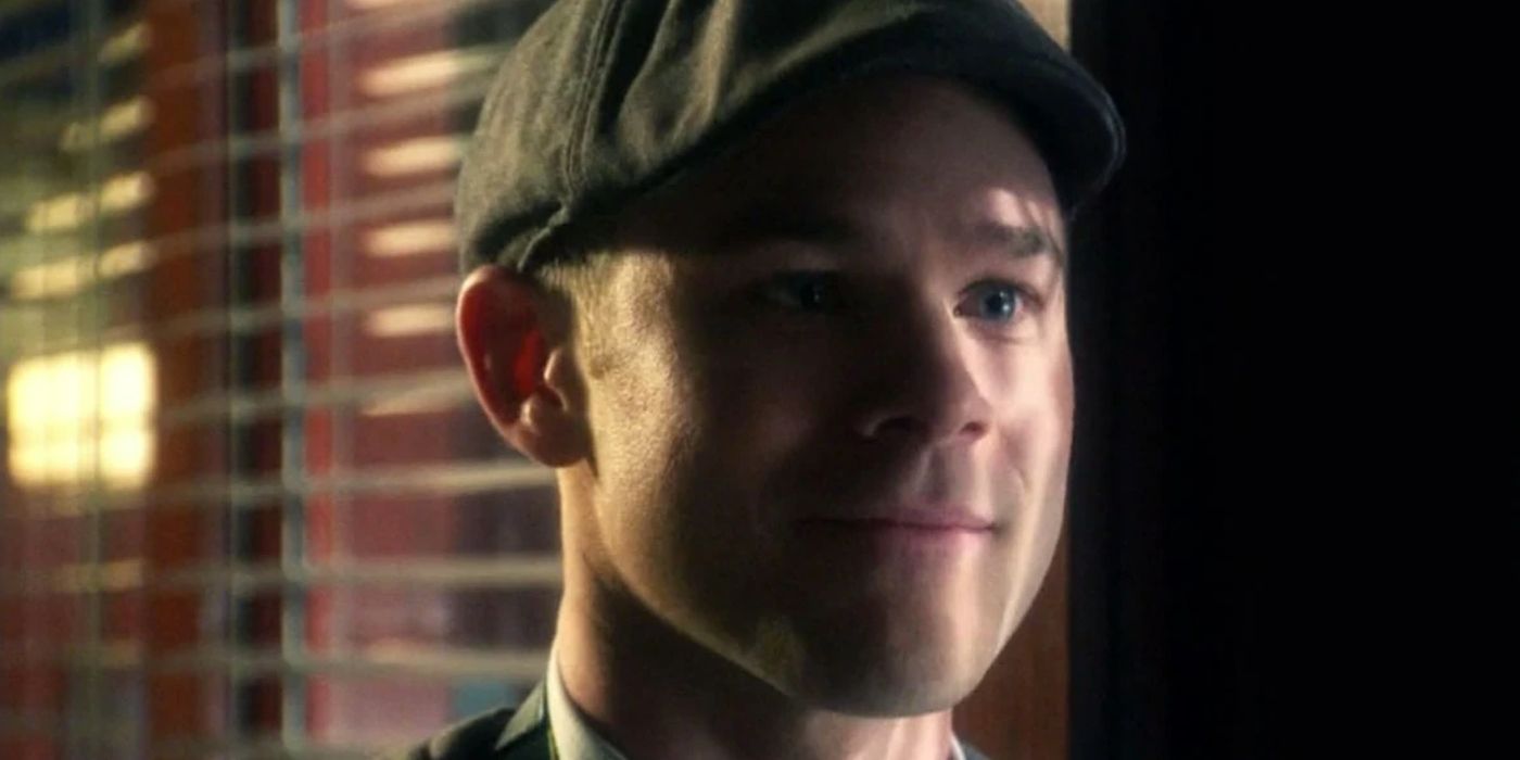Jimmy Olsen on Smallville wearing a hat looking offscreen