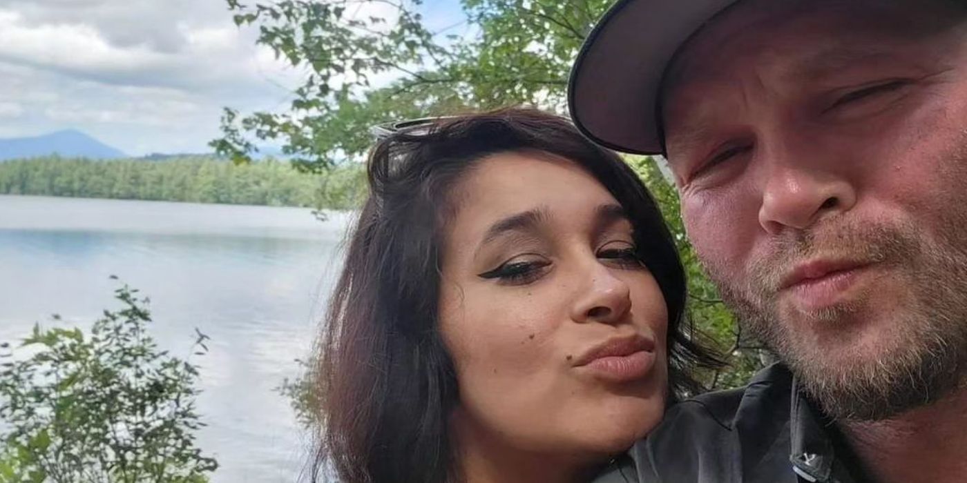 John McManus and Megan in 90 Day Fiance taking selfie with scenic background and making pouty faces