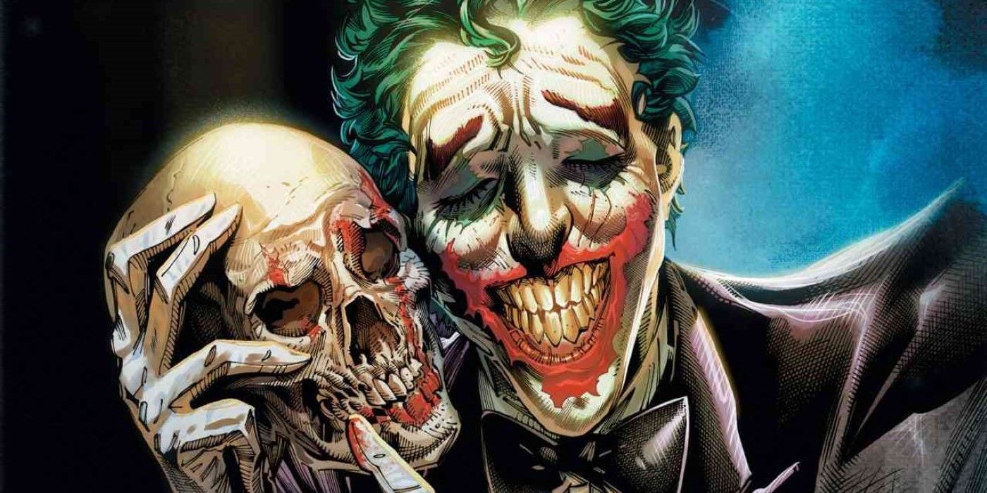 Joker holding a skull next to his face