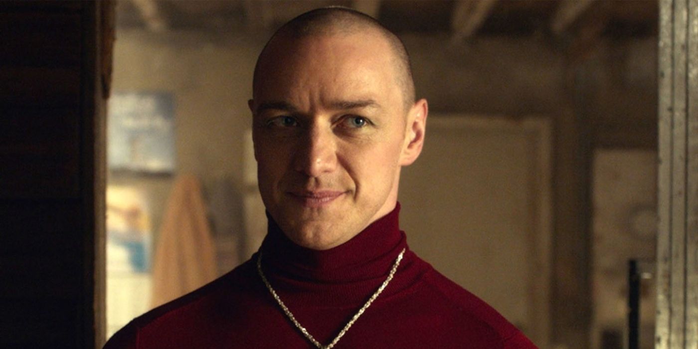 Patricia (James McAvoy) smiling and wearing a red turtleneck in Split