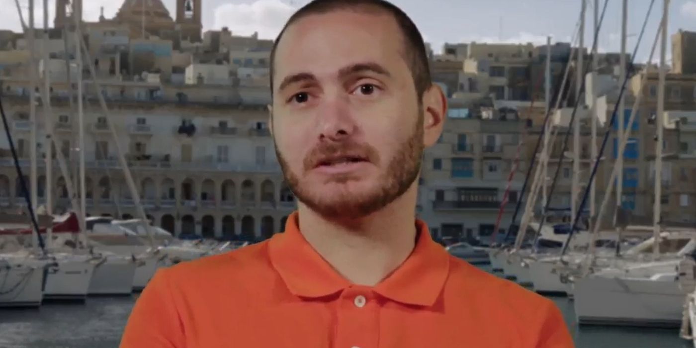 Kyle Gordy In 90 Day Fiance in orange shirt during confessional