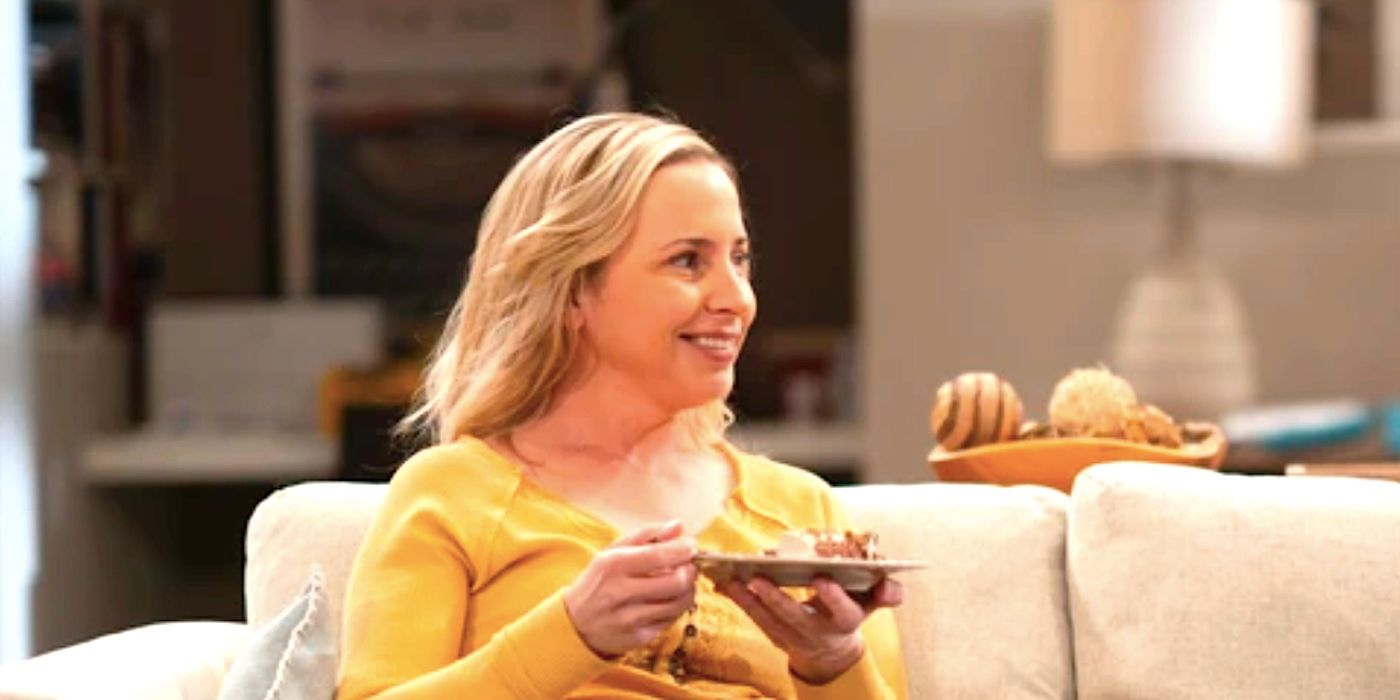 Lecy Goranson's Becky smiles while holding a plate of cake in The Conners season 6 episode 7