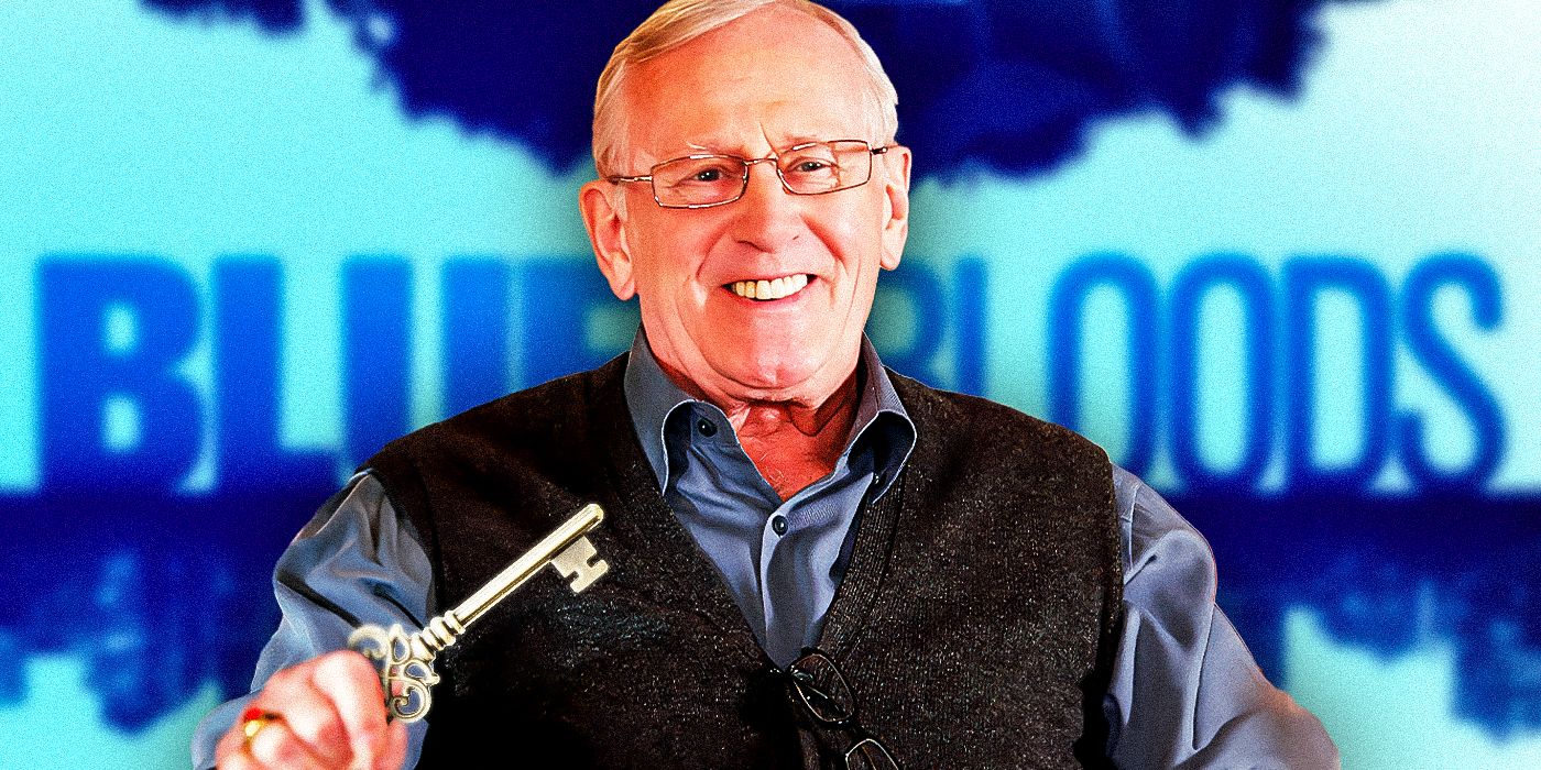 Blue Bloods' Len Cariou (Henry Reagan) is holding a large silver key. He is wearing a vest and blue dress shirt and is smiling. The background has the Blue Bloods logo and is light blue.
