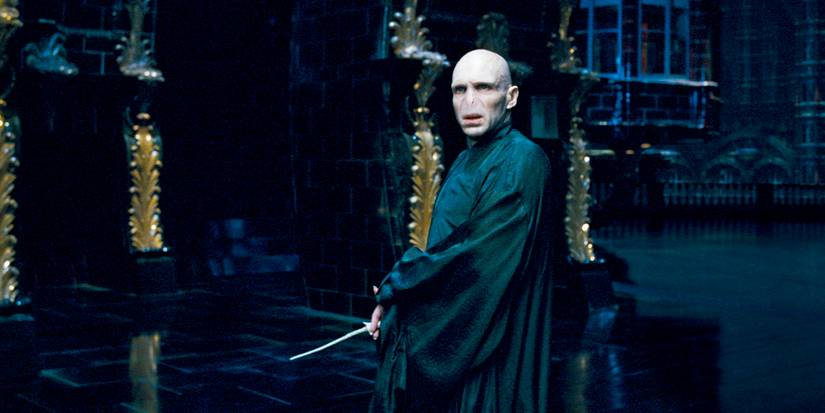 Ralph Fiennes as Lord Voldemort holding a wand in Harry Potter and the Order of the Phoenix