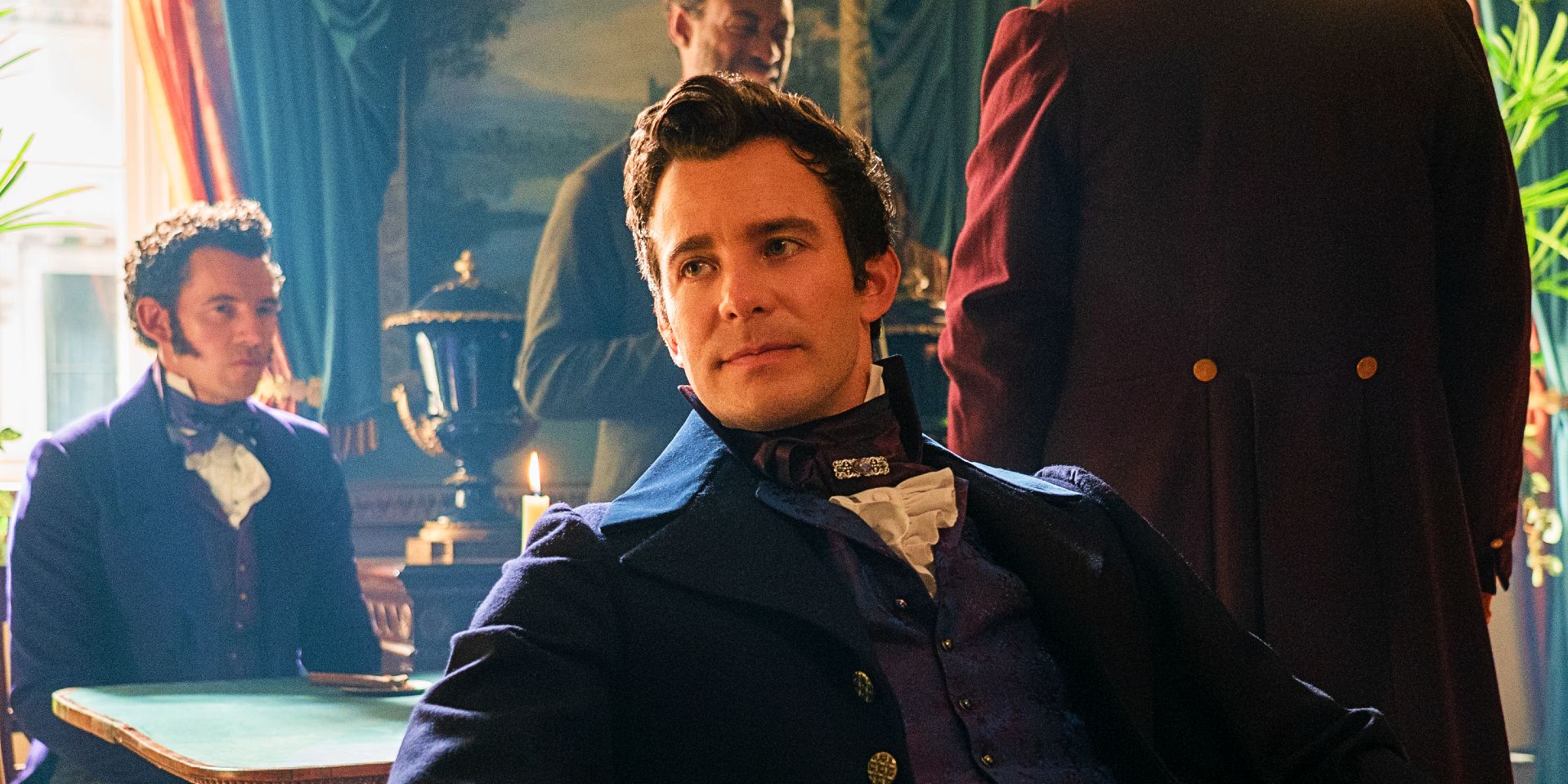 Luke Thompson as Benedict Bridgerton seated with wistful expression in Bridgerton season 3 episode 1