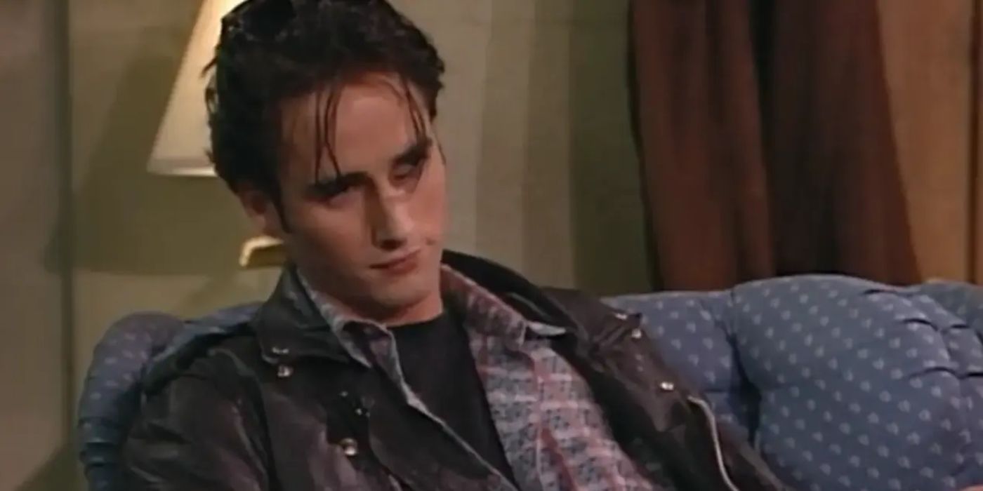 Mark Healy (Glenn Quinn) smirking in Roseanne.