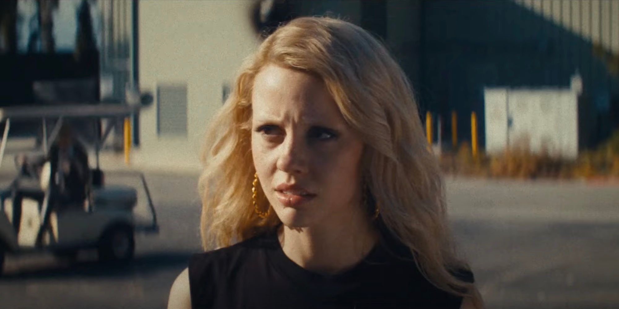 Maxine (Mia Goth) looks distraught on a studio lot in the MaXXXine trailer.