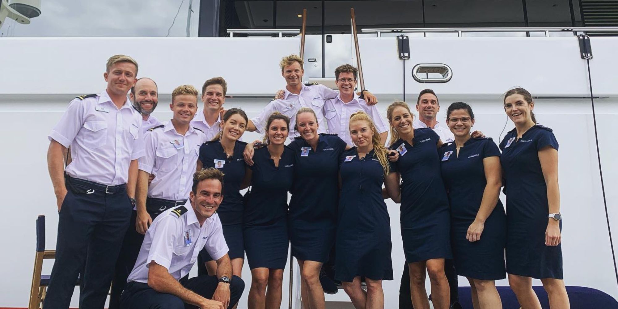 Below Deck Med Reid Jenkins and his fellow crew mates posing in on The Excellence yacht