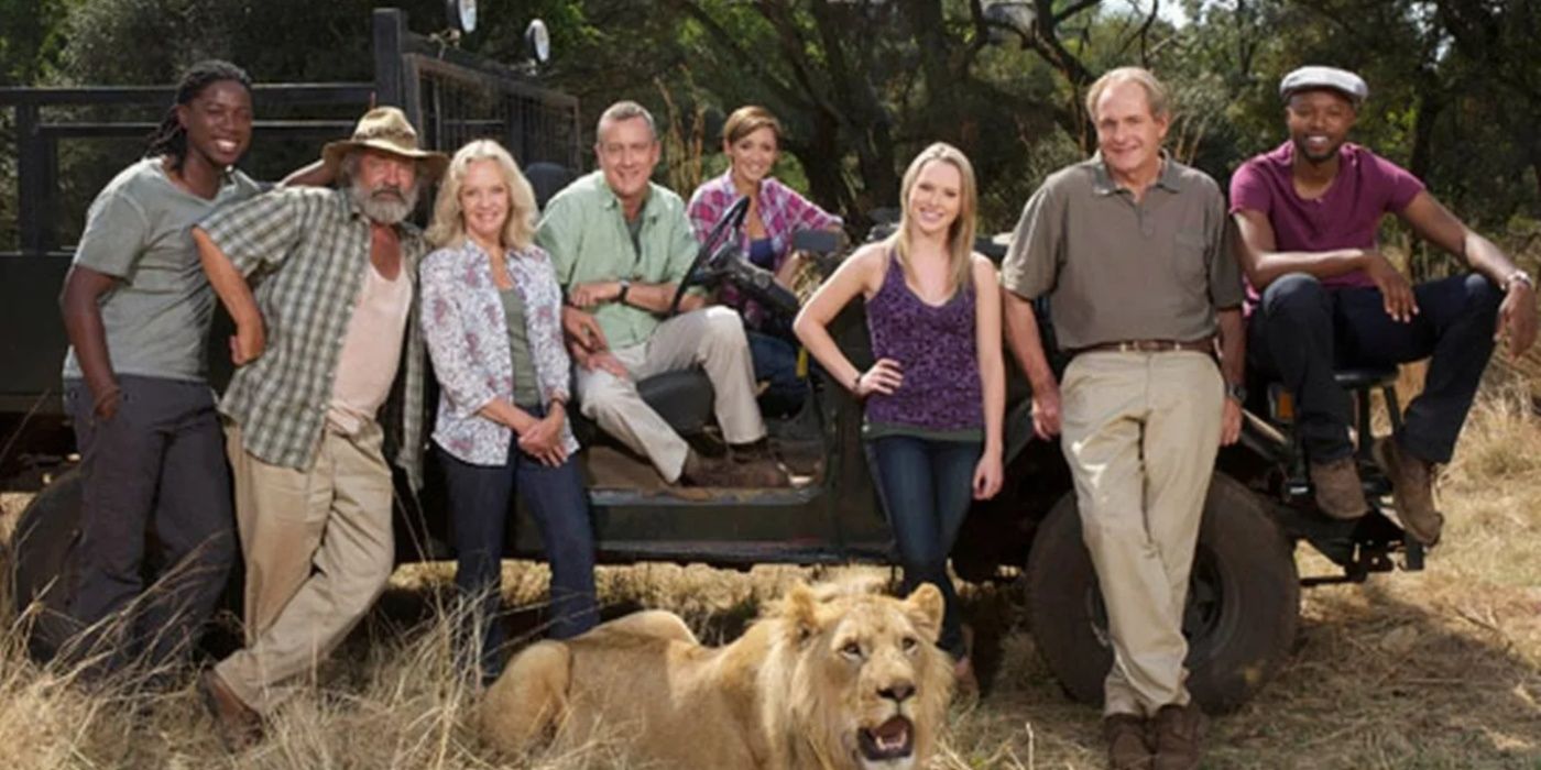 The cast of Wild at Heart pose with a lion