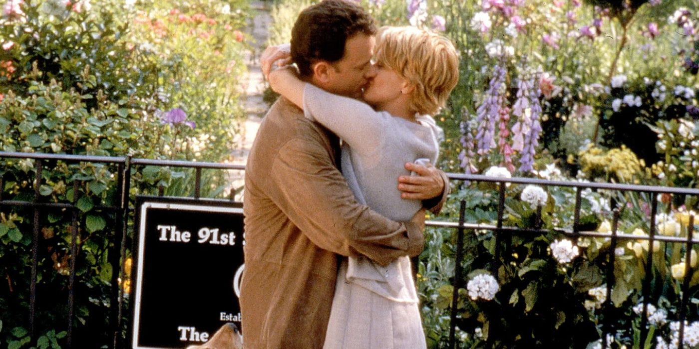 Joe (Tom Hanks) e Kathleen (Meg Ryan) se beijam em You've Got Mail