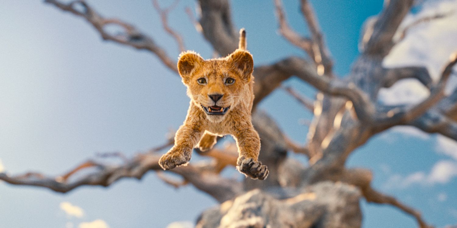Young Mufasa leaps from the top of a tree in Mufasa: The Lion King