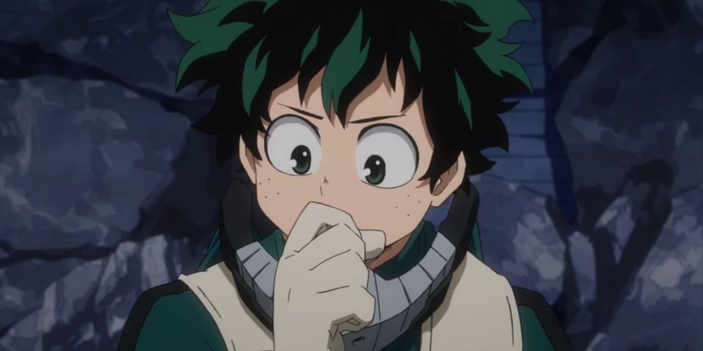 My Hero Academia's Deku holding his hand to his face and looking down in thought.