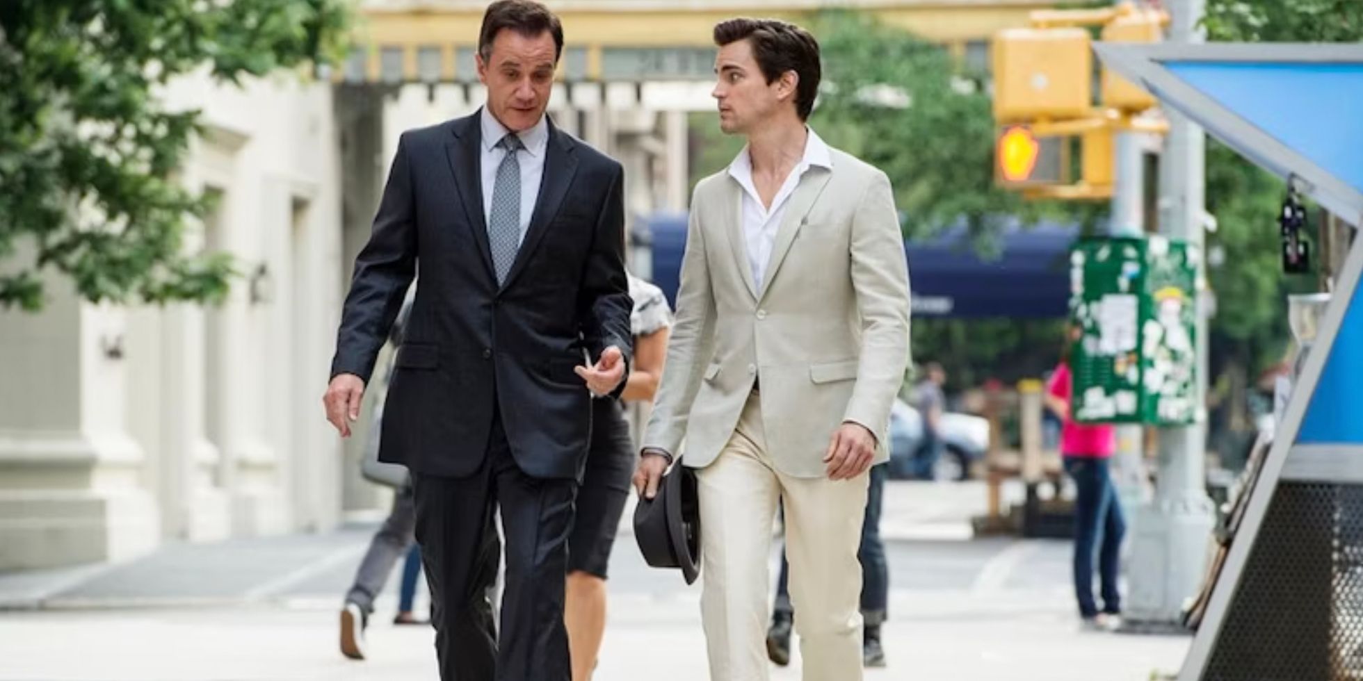 Neal and Peter walking together in White Collar