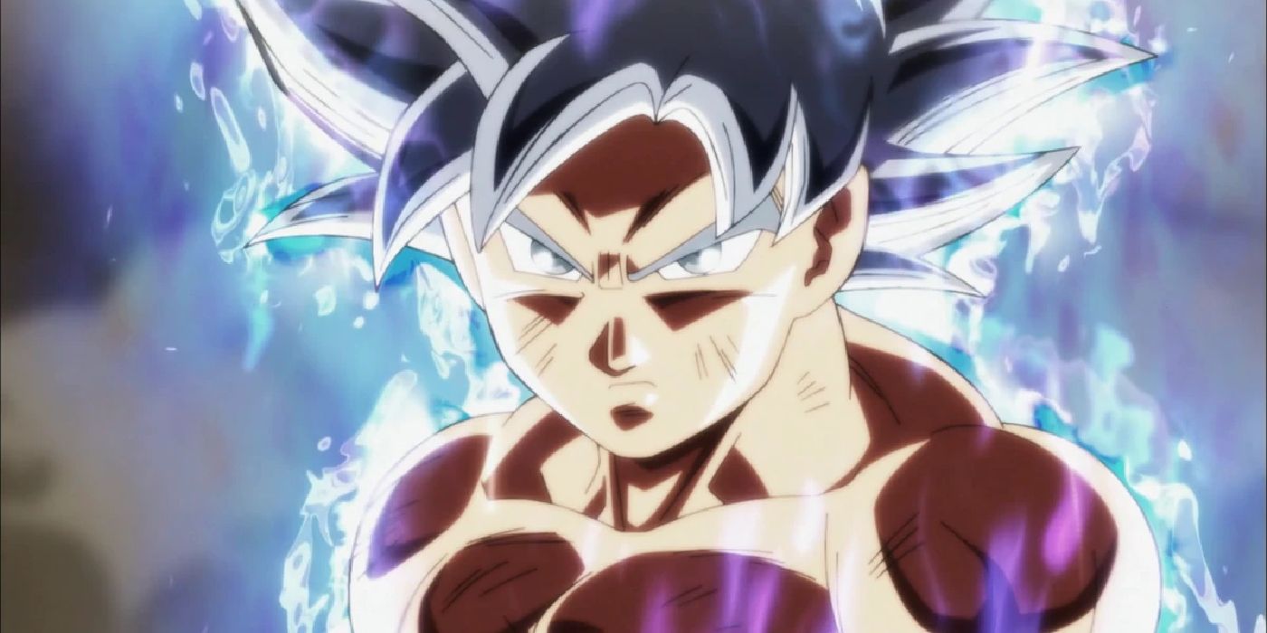 The perfected Ultra Instinct Goku looks serious in Dragon Ball Super with an aura of silver energy around him.