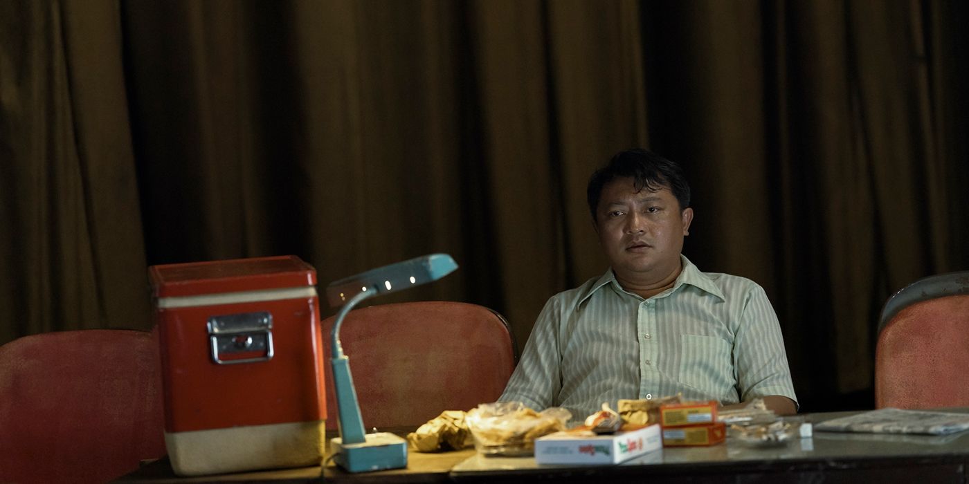 Phanxinê as the Crapulent Major looking tired in an interrogation in The Sympathizer