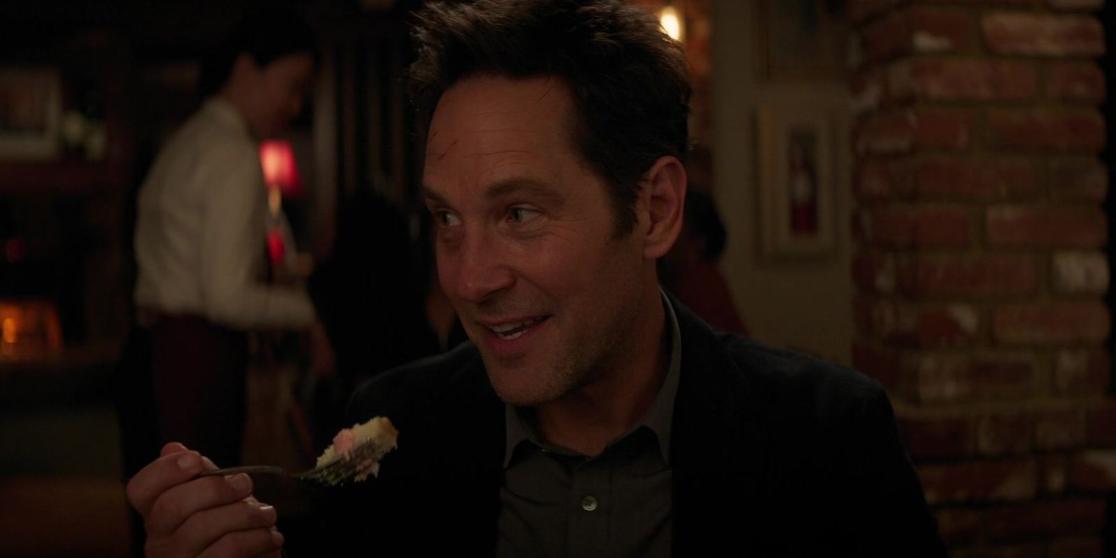 Paul Rudd as Scott Lang eating cake in Ant-Man and the Wasp: Quantumania