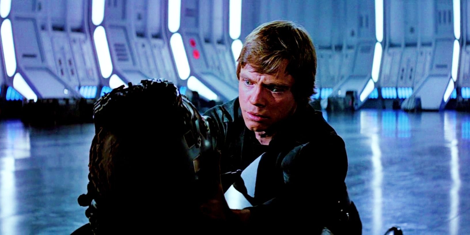 Luke looking down at a dying Darth Vader in shock at the end of Return of the Jedi